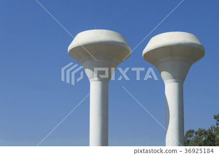 Large white water tank with blue sky background 36925184