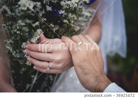 Newly-married couple holding hands 36925872