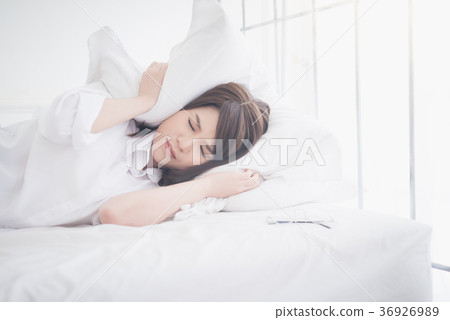 beautiful Asian women sick with sleep on bed beautiful Asian women sick with sleep on bed 36926989