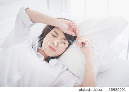 beautiful Asian women sick with sleep on bed beautiful Asian women sick with sleep on bed 36926991