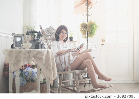 Asian girl in glasses using tablet 36927093