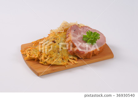 smoked pork with potato pancakes and sauerkraut 36930540