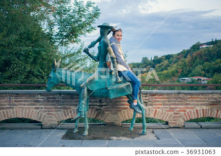 Girl in a white vest with a backpack. Next bronze Girl in a white vest with a backpack. Next bronze 36931063