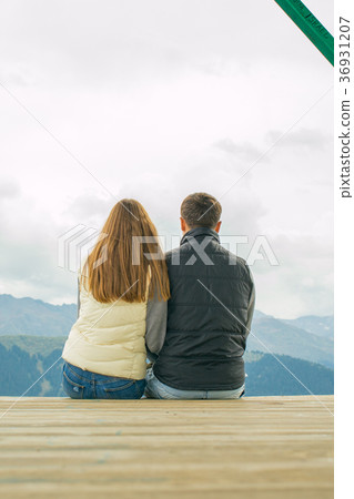 A boy with a girl in the mountains in the A boy with a girl in the mountains in the 36931207