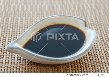 Soy sauce in a small dish 36931930