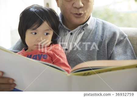 Senior playing with grandson Senior playing with grandson 36932759