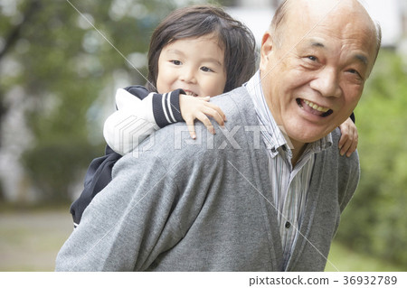 Senior playing with grandson Senior playing with grandson 36932789