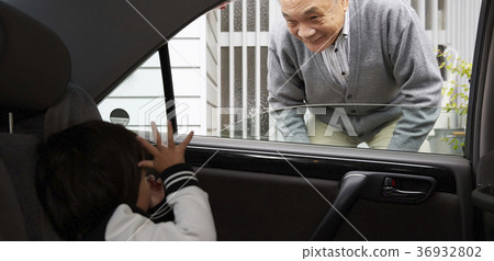 Senior watching off grandchild 36932802