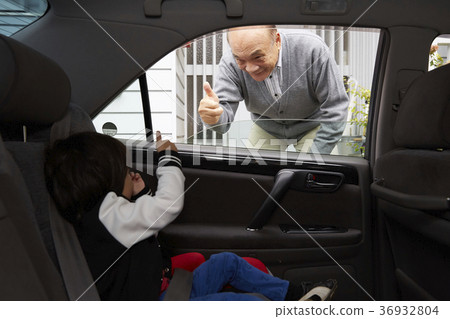 Senior watching off grandchild 36932804