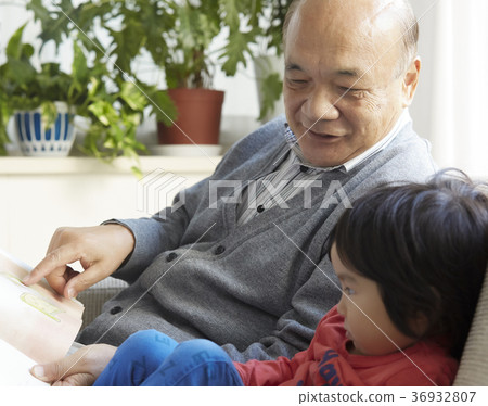 Senior playing with grandson Senior playing with grandson 36932807