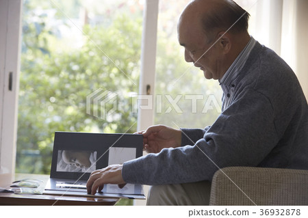 Senior looking at photos 36932878