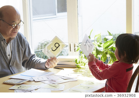 Senior with child studying 36932908