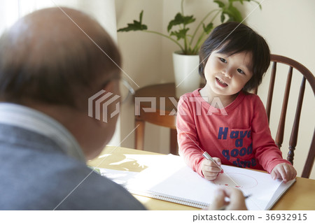 Senior playing with grandson Senior playing with grandson 36932915