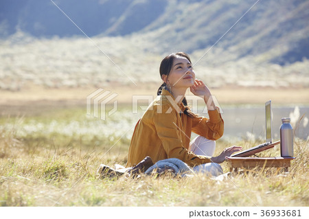 Woman working in the meadow 36933681