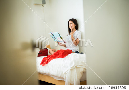 A woman preparing for a trip A woman preparing for a trip 36933808
