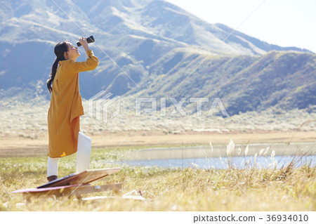 Woman working in the meadow Woman working in the meadow 36934010