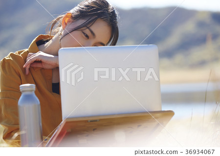 Woman working in the meadow 36934067