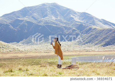 Woman working in the meadow 36934071