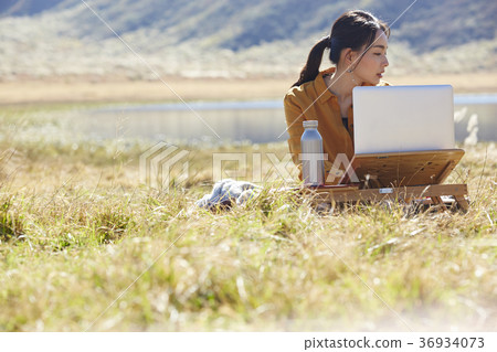 Woman working in the meadow 36934073