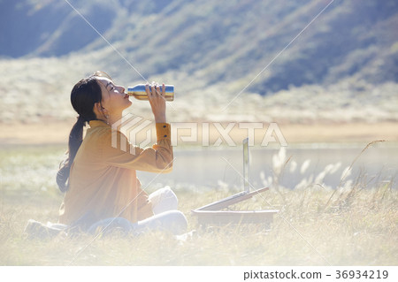 Woman working in the meadow 36934219