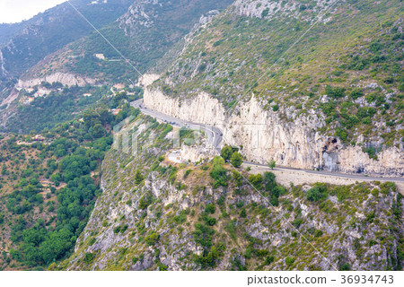 Daylight foggy view to Eze village, trees Daylight foggy view to Eze village, trees 36934743