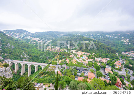 Daylight foggy view to Medieval stone arch bridge 36934756