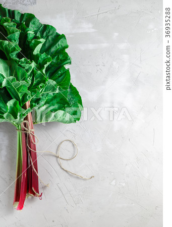 Fresh organic rhubarb on grey concrete background 36935288