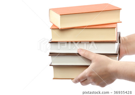 Stack of books in female hands on white background 36935428