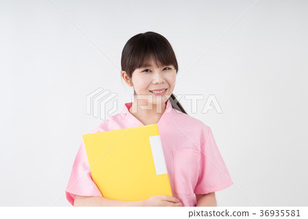 Healthcare worker holding file with smile 36935581