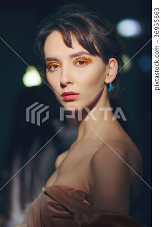 Portrait of beautiful girl in coat with fur collar 36935863