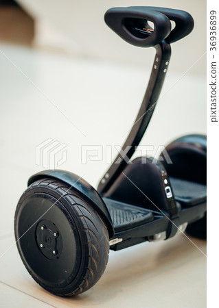 Segway on parquet. electric scooter. black 36936899