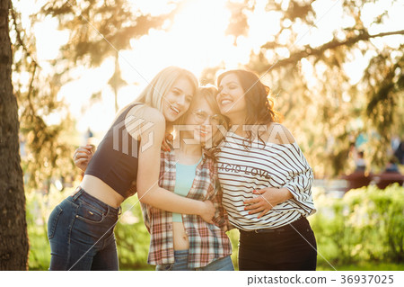 woman hugging each other in close embrace while 36937025