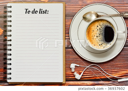 Filling up to do list during a coffee break 36937602