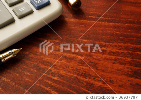 Calculator on a wooden table. Business background. Calculator on a wooden table. Business background. 36937797