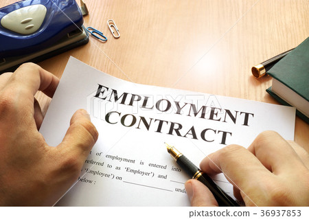 Employment contract on an office table. Employment contract on an office table. 36937853