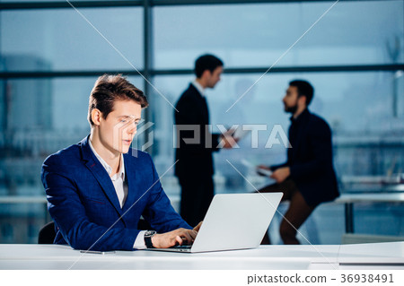 Business man or accountant working on laptop Business man or accountant working on laptop 36938491