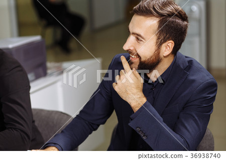 businessman sitting at business meeting businessman sitting at business meeting 36938740