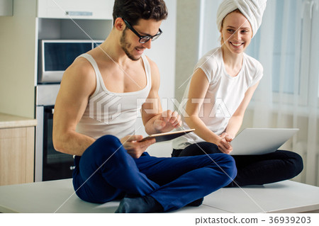 Couple having some laughs on table 36939203