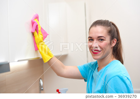 Charming woman doing cleaning Charming woman doing cleaning 36939270