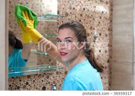 Charming woman doing cleaning Charming woman doing cleaning 36939317