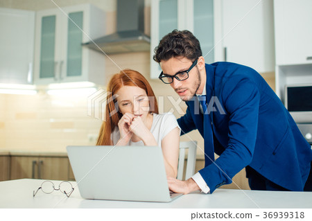 Two analysts discussing online data in front of Two analysts discussing online data in front of 36939318