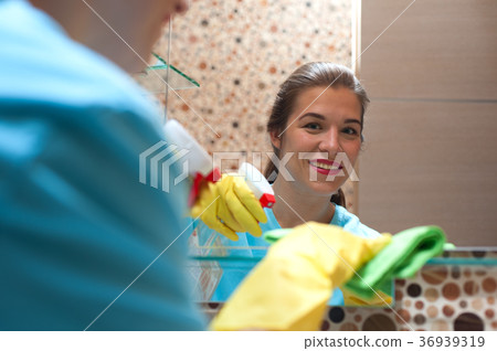 Charming woman doing cleaning Charming woman doing cleaning 36939319