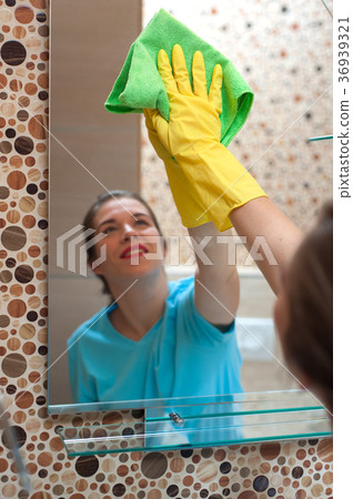 Charming woman doing cleaning Charming woman doing cleaning 36939321