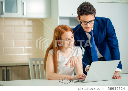 Couple enjoying time together browsing laptop. man 36939324