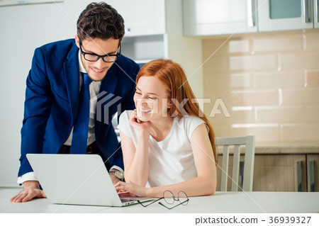 Couple enjoying time together browsing laptop. man 36939327