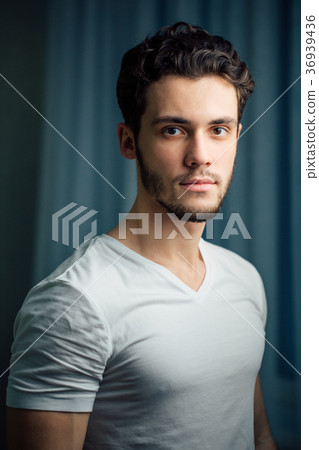 young bearded man in white shirt 36939436