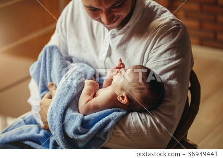 Father With Newborn Baby Working From Home Using Father With Newborn Baby Working From Home Using 36939441