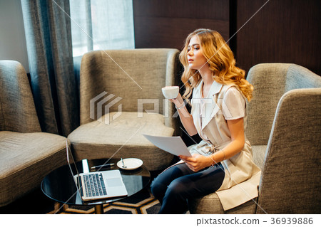 Woman Account Manager Working at Wood Table with 36939886