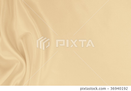 Smooth elegant golden silk or satin luxury cloth Smooth elegant golden silk or satin luxury cloth 36940192
