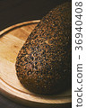 Black bread with seeds on dark background 36940408